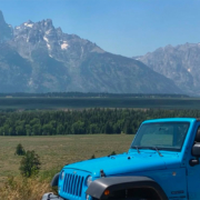 Backcountry Safaris Jeep on Jackson Hole Tour in Front of the Teton Mountain Range