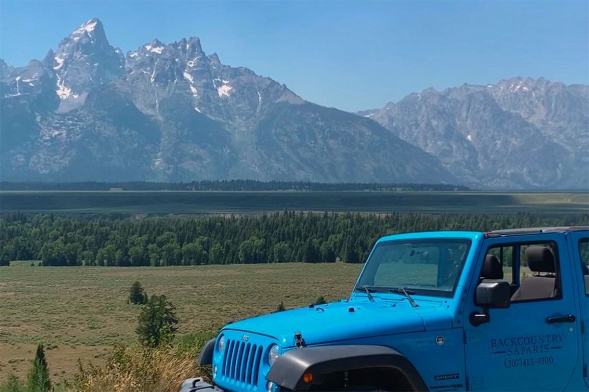 Backcountry Safaris Jeep on Jackson Hole Tour in Front of the Teton Mountain Range