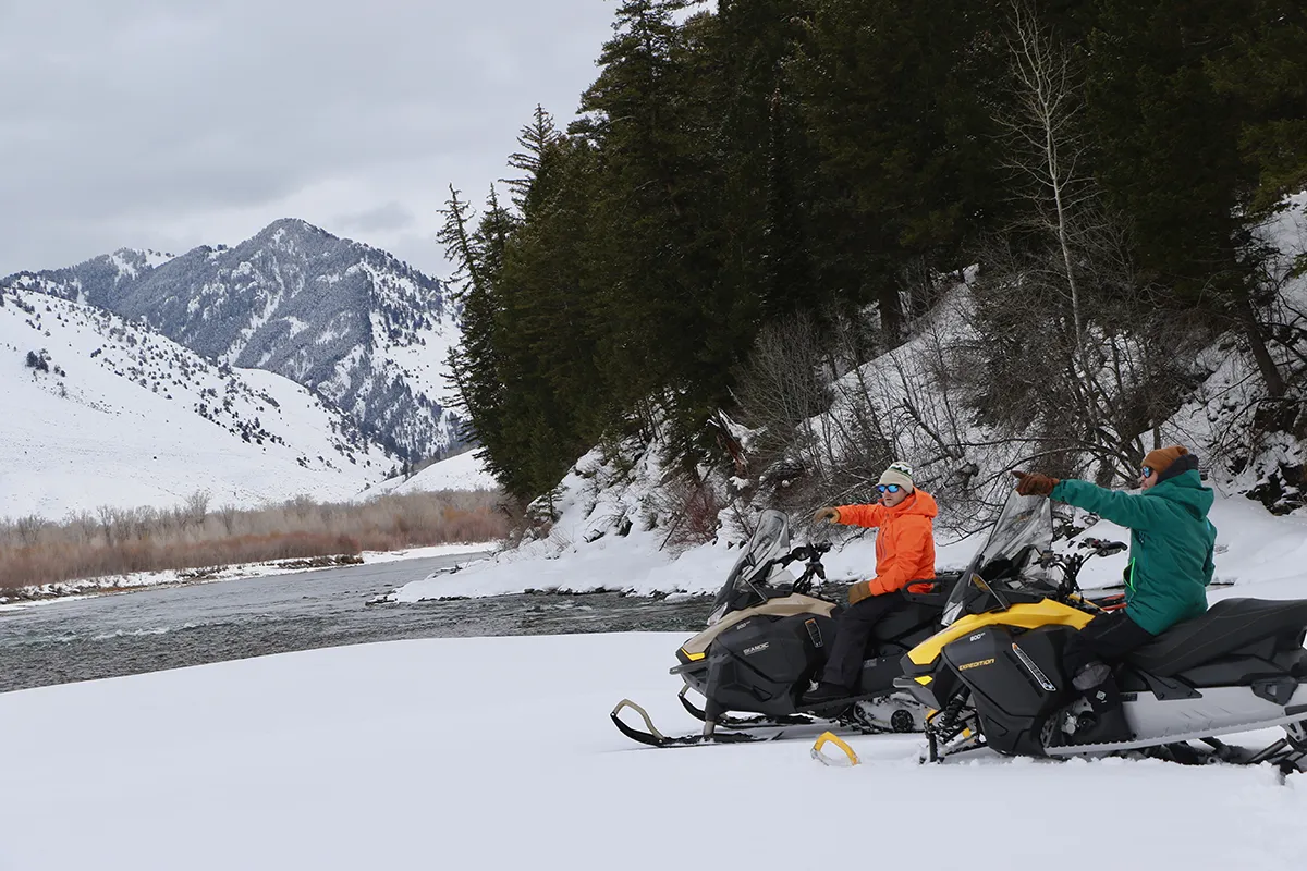 Snowmobile Guide with Guest on Jackson Hole Snowmobile Tour by the Snake River - Backcountry Safaris
