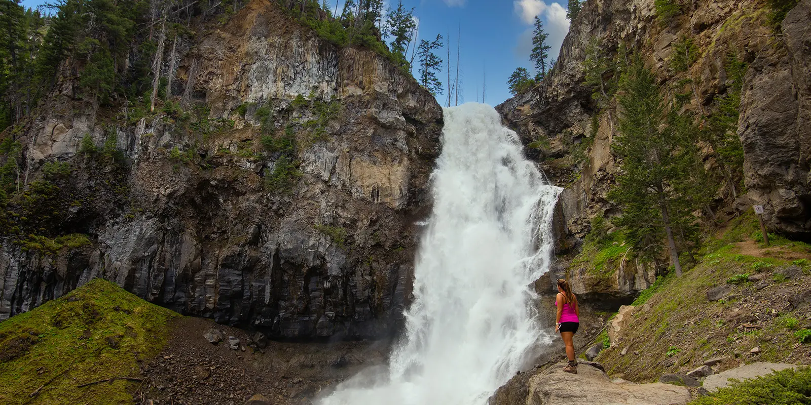 Woman Viewing Waterfall on Guided Yellowstone Hiking Tour - Backcountry Safaris