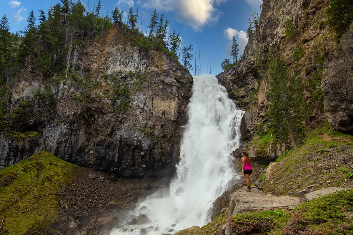 Woman Viewing Waterfall on Guided Yellowstone Hiking Tour - Backcountry Safaris