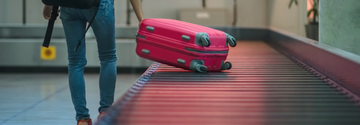 Red Luggage at Carousel